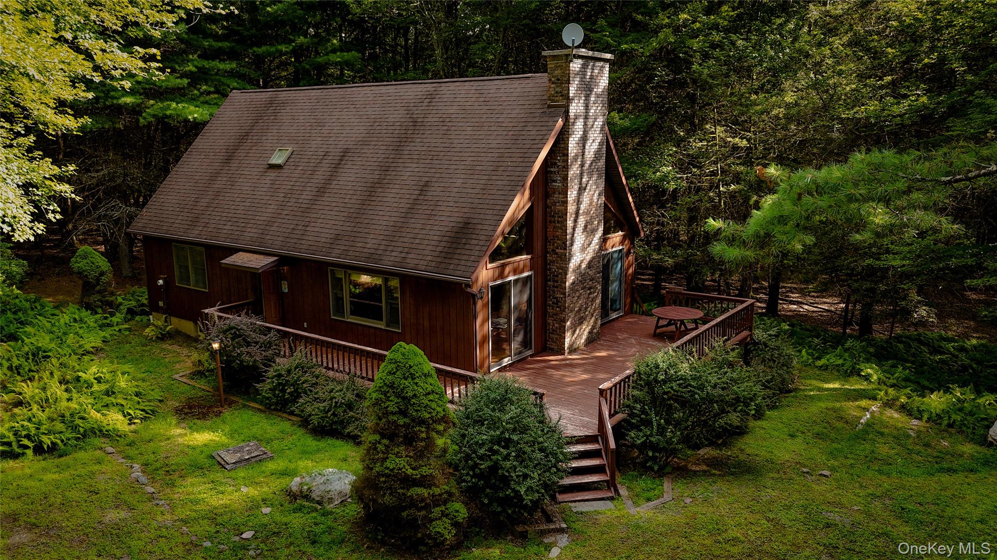 72 Black Lake Road Bethel, NY 12786 - Photo 2 of 22 an aerial view of a house with yard table and chairs