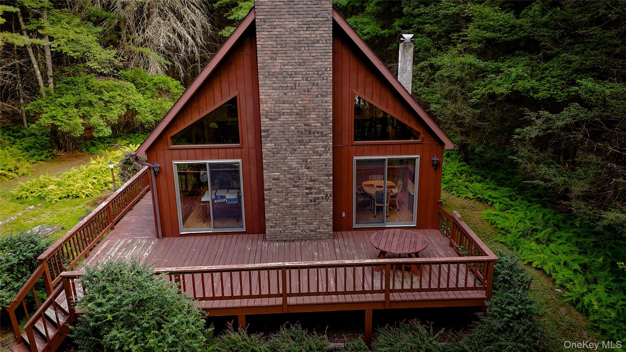 72 Black Lake Road Bethel, NY 12786 - Photo 5 of 22 a view of a house with balcony and wooden stairs