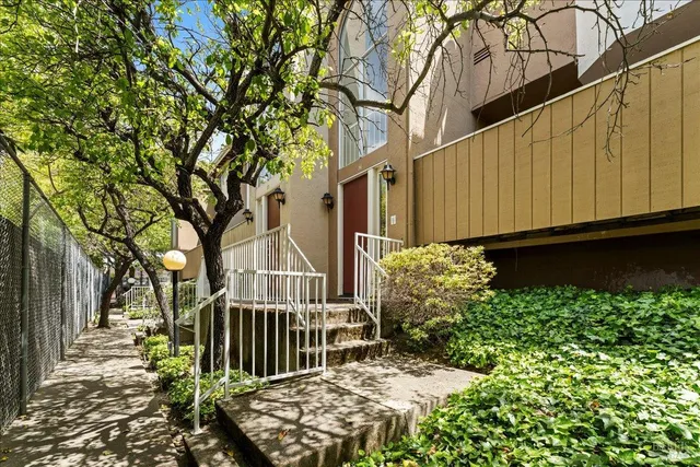 a view of a house with a flower garden