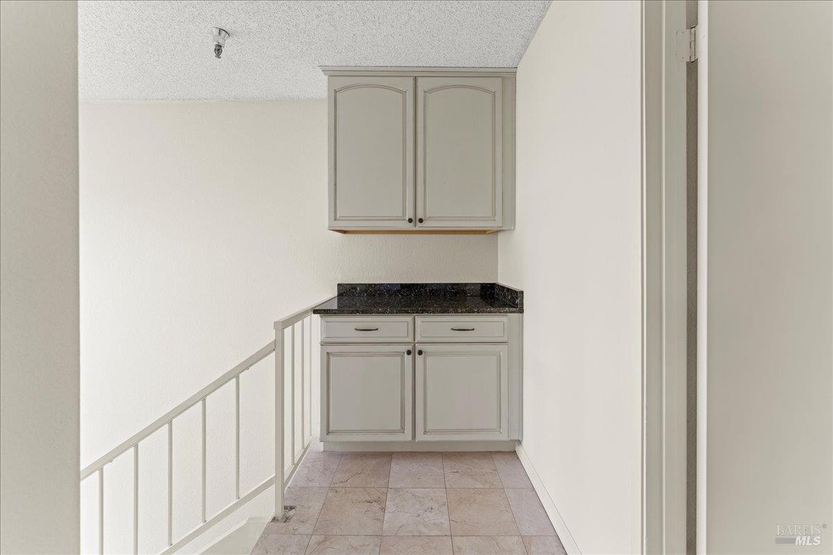 2121 Vale Road, Unit 31 San Pablo, CA 94806 - Photo 18 of 36 a view of a hallway with white cabinets