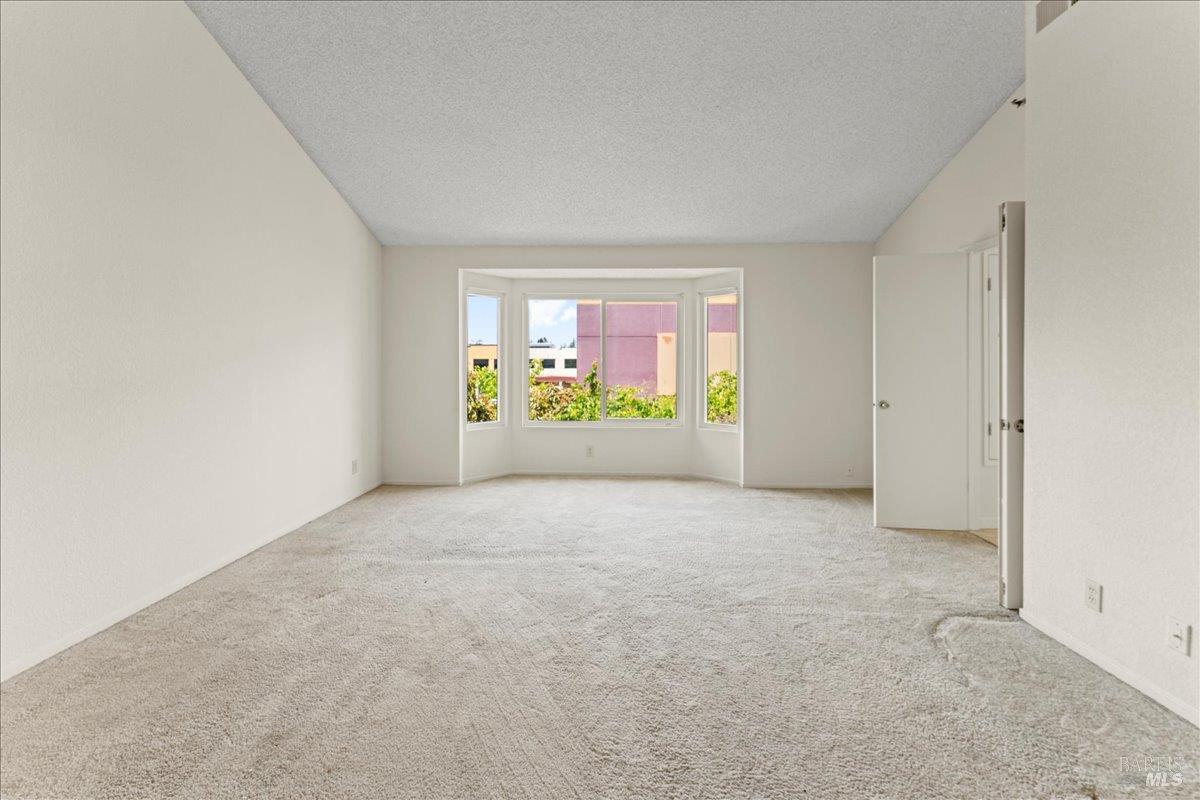 2121 Vale Road, Unit 31 San Pablo, CA 94806 - Photo 19 of 36 a view of an empty room with a window