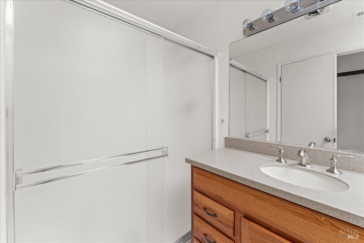 2121 Vale Road, Unit 31 San Pablo, CA 94806 - Photo 31 of 36 a bathroom with a sink and a mirror