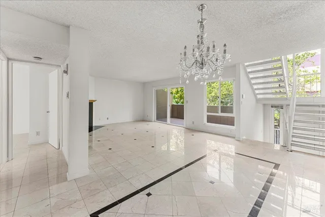 a kitchen with granite countertop cabinets stainless steel appliances and a counter space