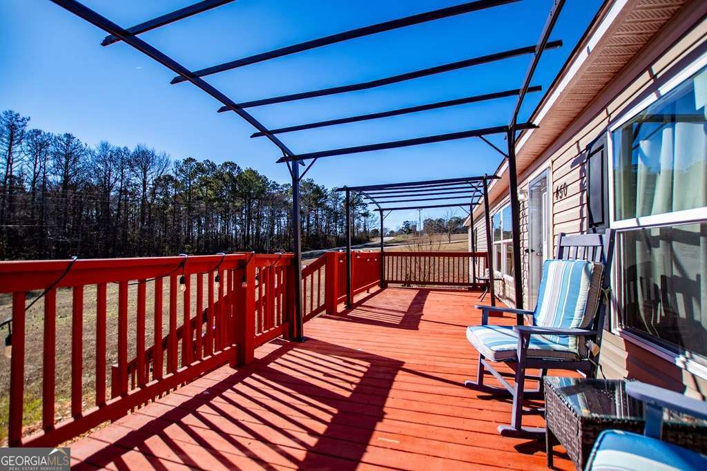 450 Glenloch Road Roopville, GA 30170 - Photo 6 of 38 a view of deck with wooden floor and outdoor seating