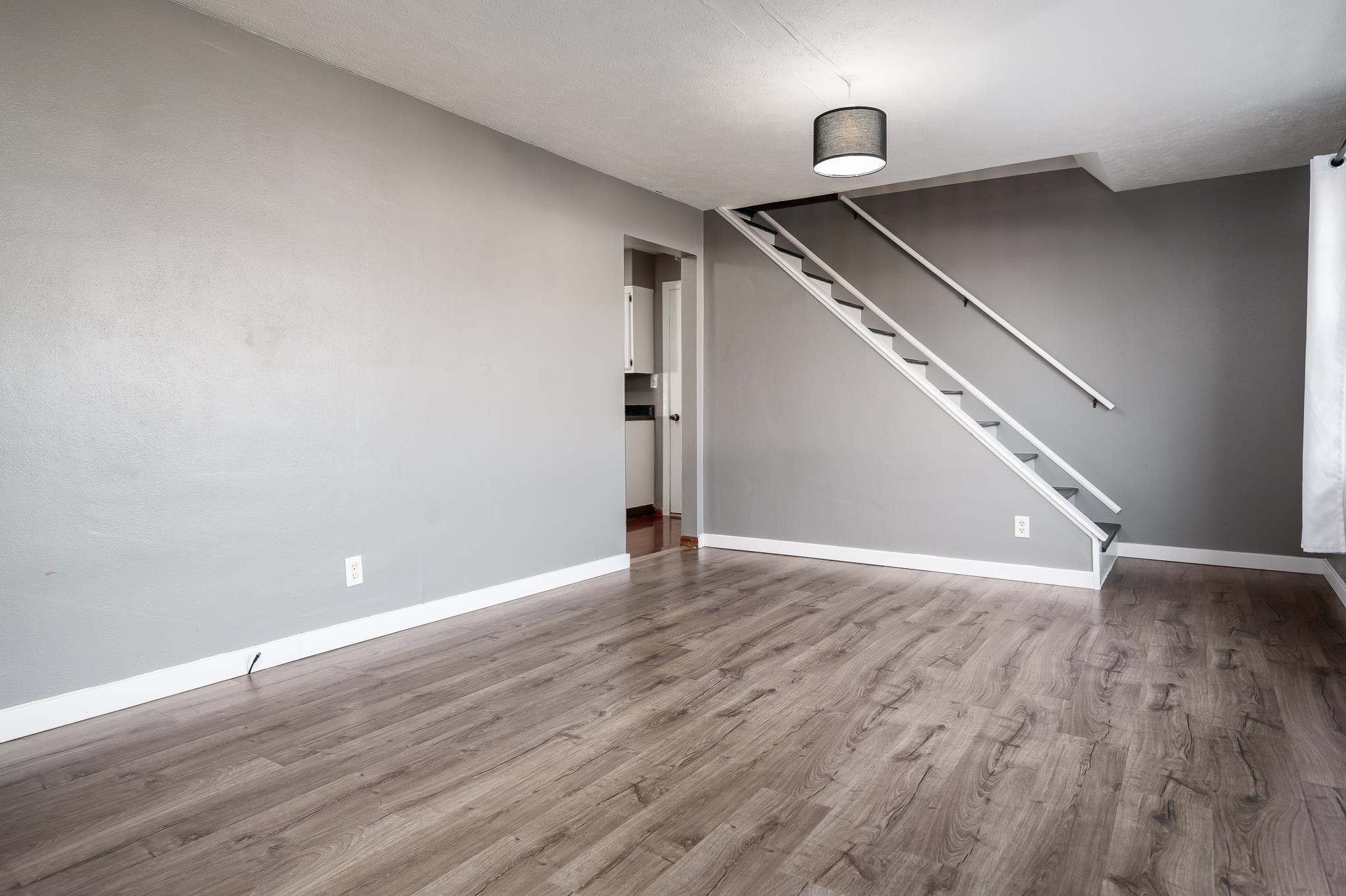 237 Theodore Street Loves Park, IL 61111 - Photo 7 of 33 a view of an empty room with wooden floor