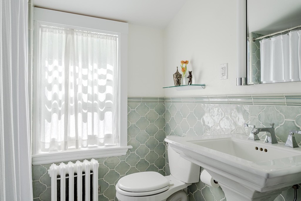 34 Jane Road Newton, MA 02459 - Photo 8 of 12 a bathroom with a sink a toilet and a mirror