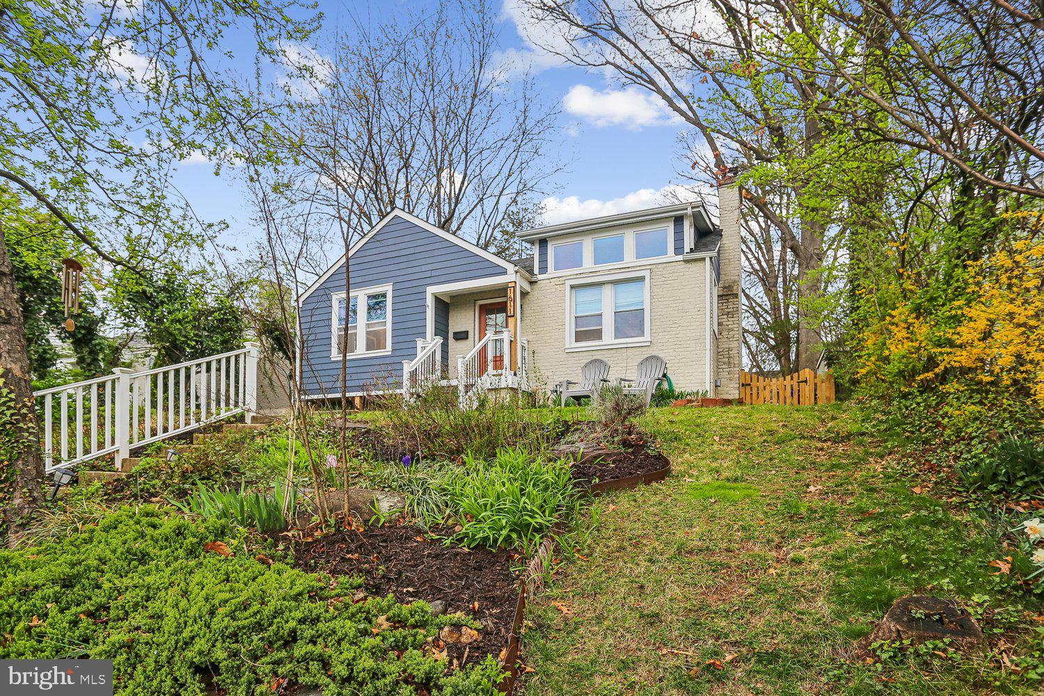 1611 Noyes Drive Silver Spring, MD 20910 - Photo 1 of 47 a front view of a house with garden