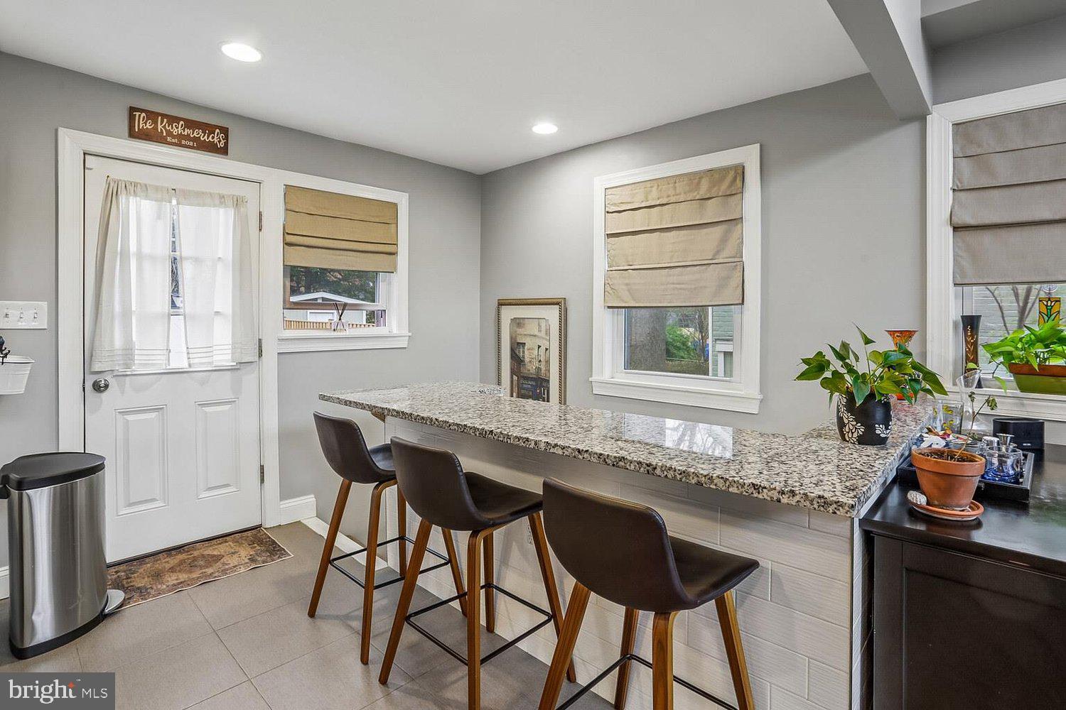 1611 Noyes Drive Silver Spring, MD 20910 - Photo 17 of 47 a kitchen with a table and chairs in it