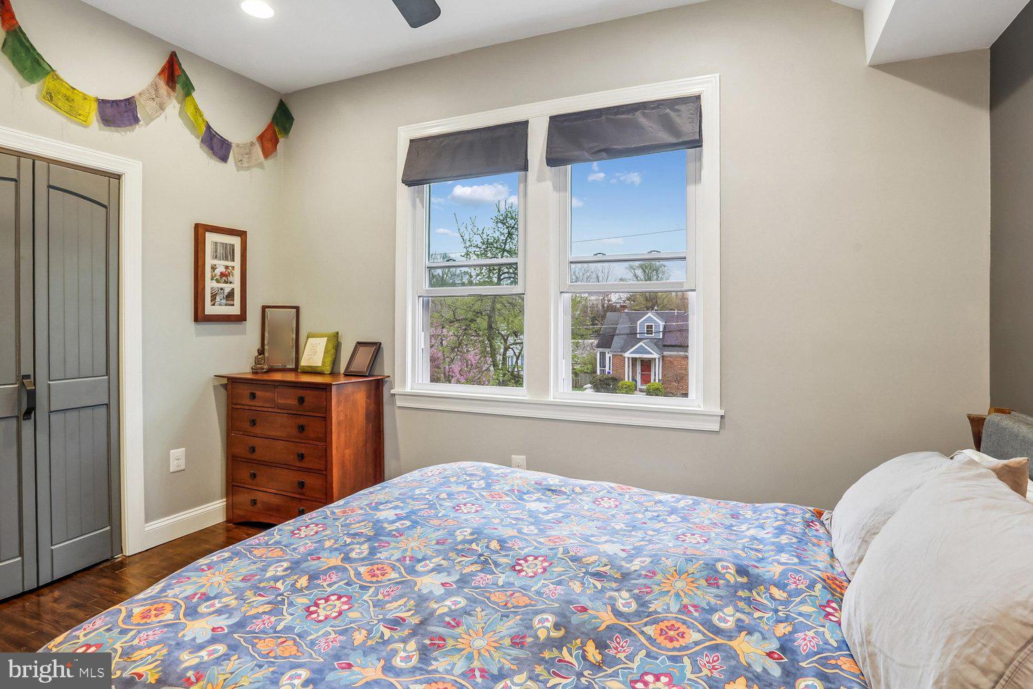 1611 Noyes Drive Silver Spring, MD 20910 - Photo 19 of 47 a bedroom with a bed and a dresser next to a window