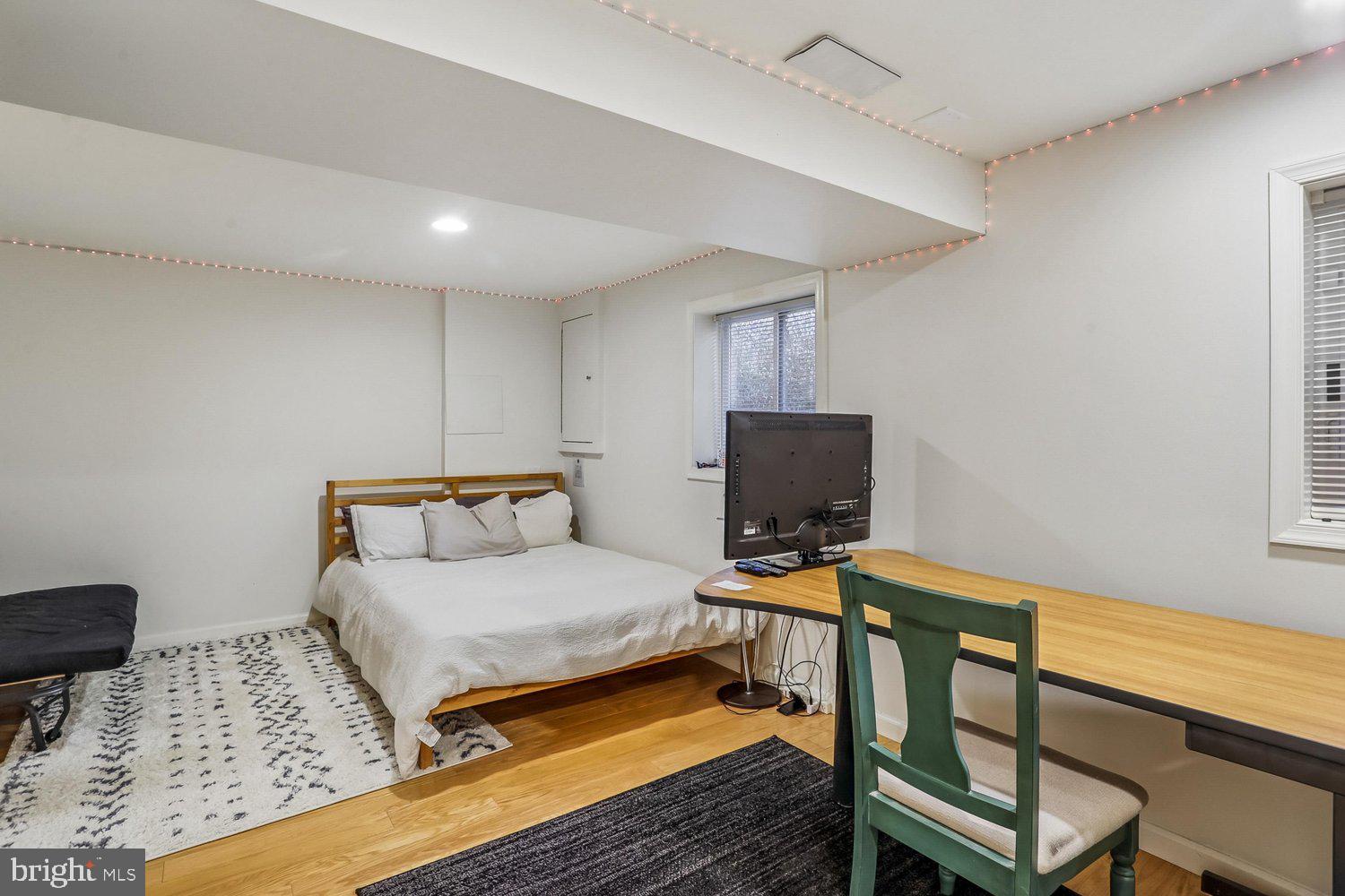 1611 Noyes Drive Silver Spring, MD 20910 - Photo 24 of 47 a bedroom with a bed and a chair