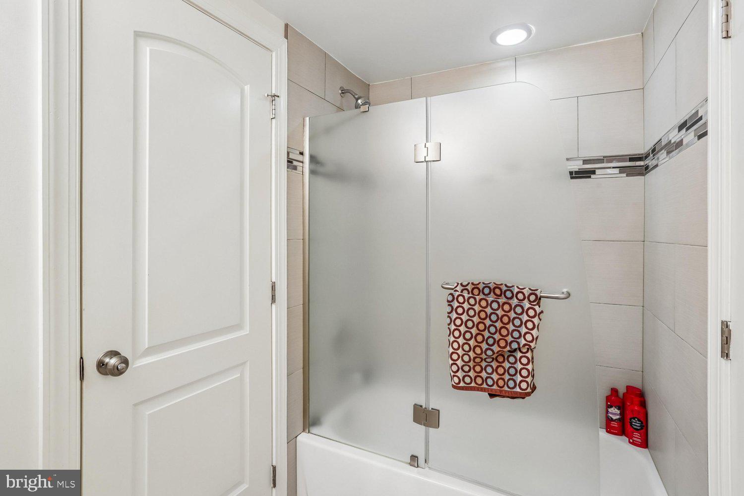 1611 Noyes Drive Silver Spring, MD 20910 - Photo 25 of 47 a bathroom with a bathtub and a shower