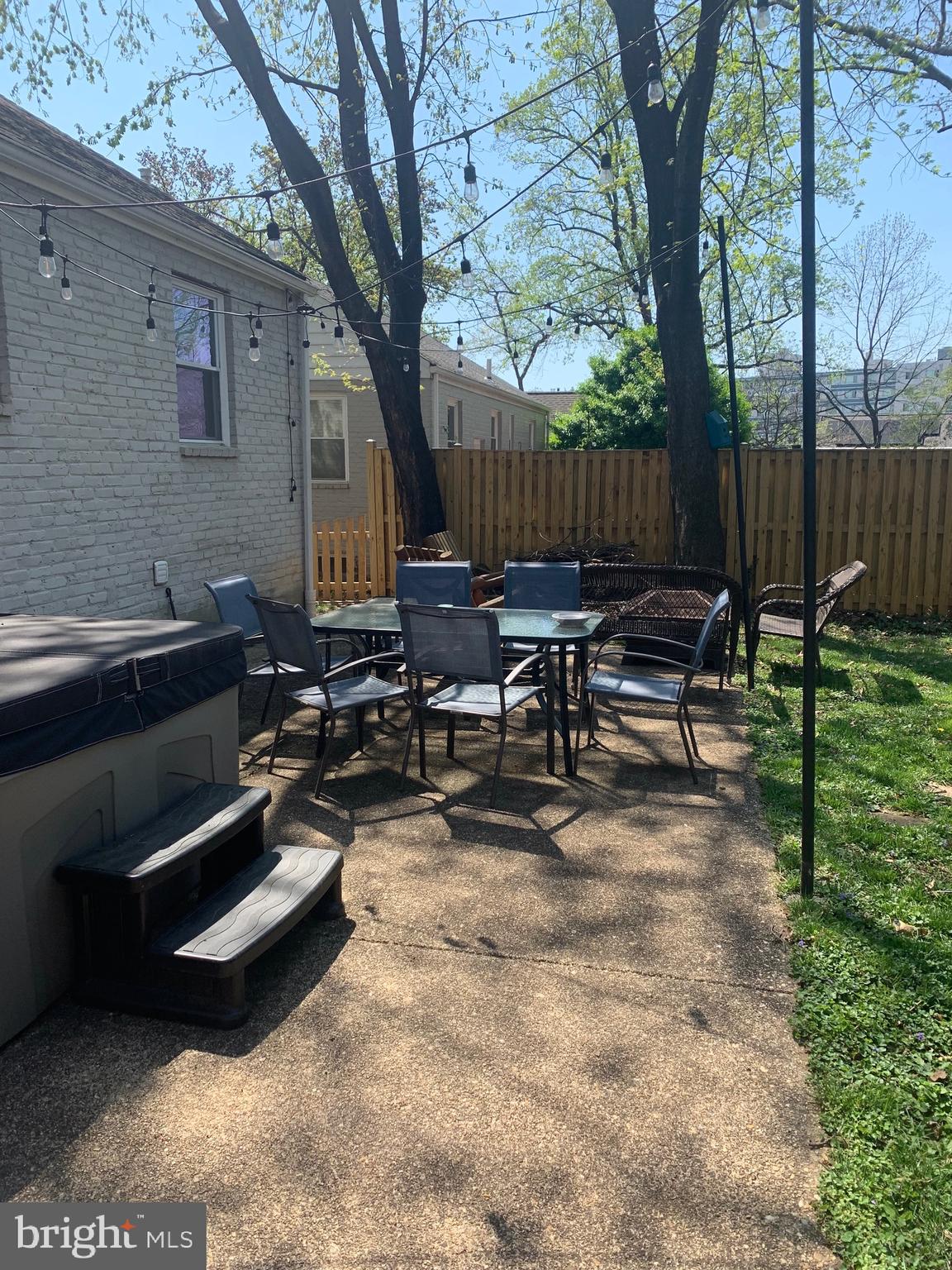 1611 Noyes Drive Silver Spring, MD 20910 - Photo 36 of 47 a backyard of a house with table and chairs