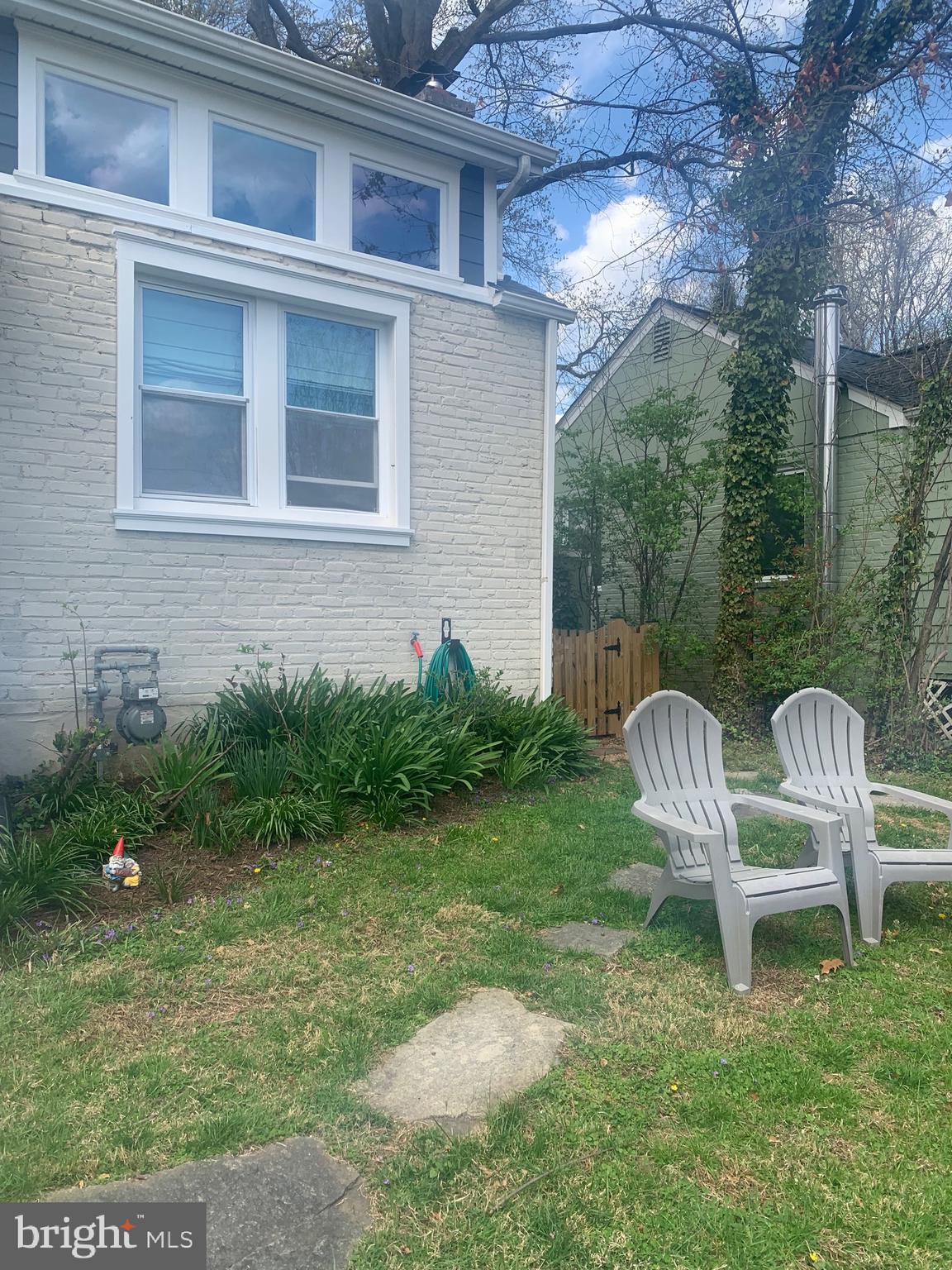 1611 Noyes Drive Silver Spring, MD 20910 - Photo 5 of 47 a backyard of a house with table and chairs