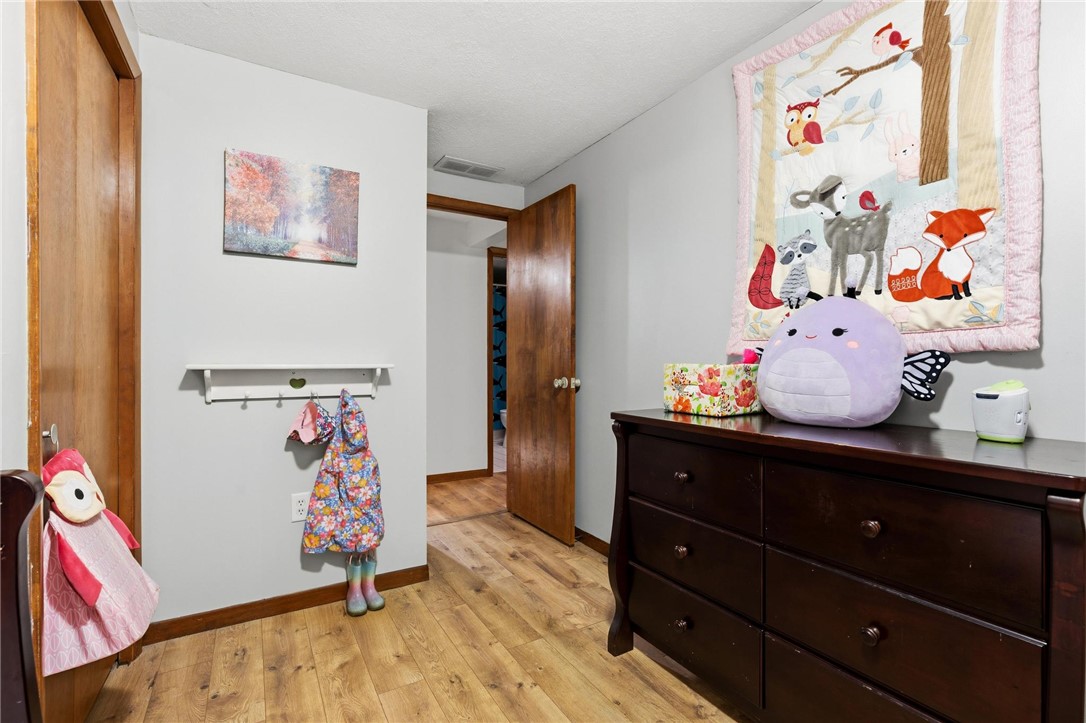 1940 Armstrong Road Fairborn, OH 45324 - Photo 28 of 48 This cozy bedroom features durable wood flooring and ample storage space.