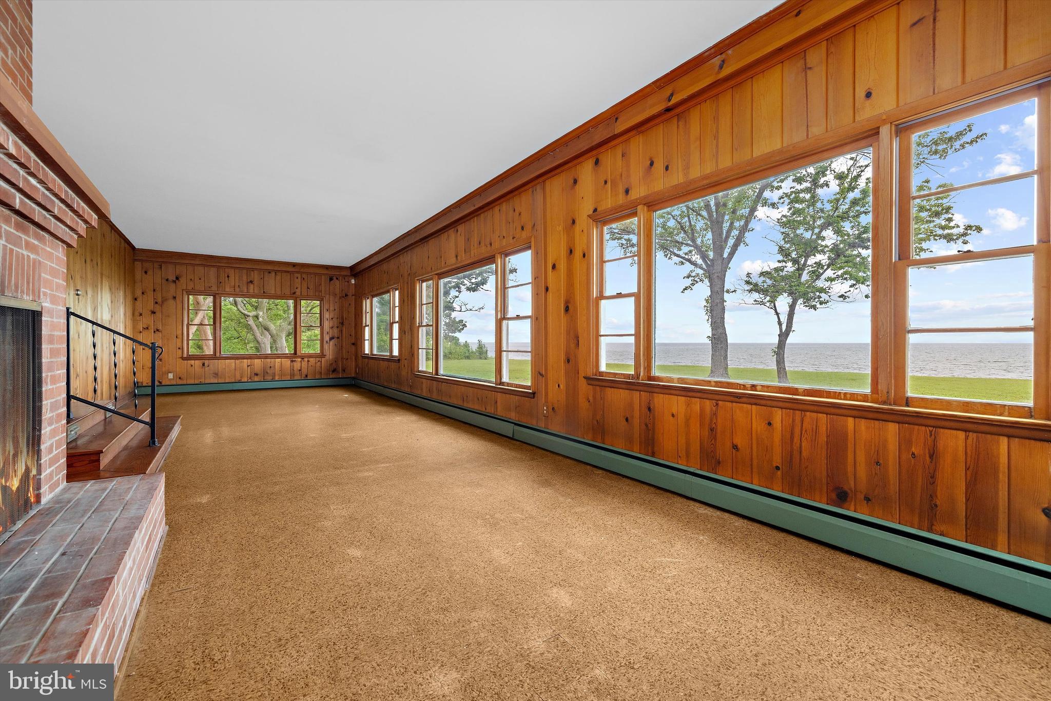 500 Nesbit Road Queenstown, MD 21658 - Photo 7 of 53 a view of an empty room with wooden floor and a window