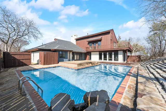 a front view of a house with swimming pool