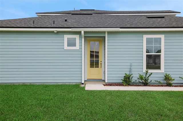 a front view of a house with a yard