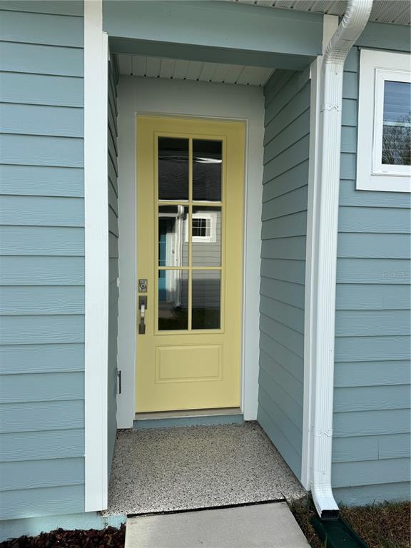 231 Misty Harbor Trace Palm Coast, FL 32137 - Photo 8 of 16 a view of front door of house