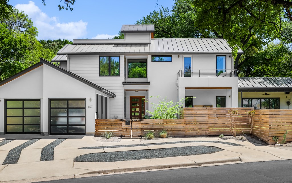 a front view of a house with a garage