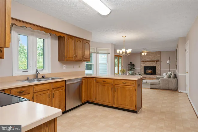 a large white kitchen with a large window
