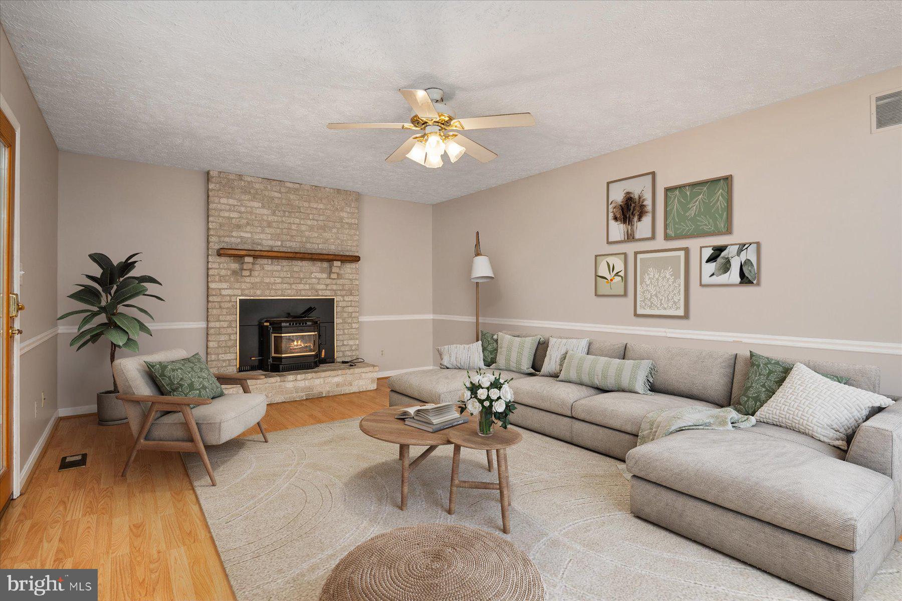 7907 Poplar Grove Road Severn, MD 21144 - Photo 14 of 38 a living room with furniture and a fireplace