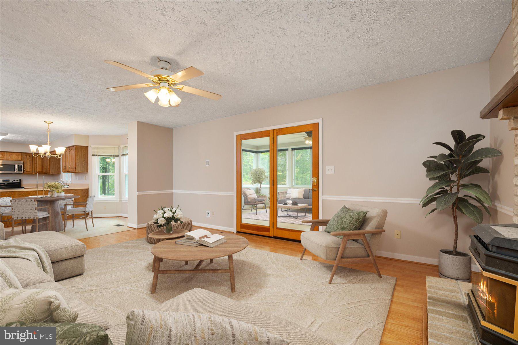7907 Poplar Grove Road Severn, MD 21144 - Photo 15 of 38 a living room with furniture and a large window