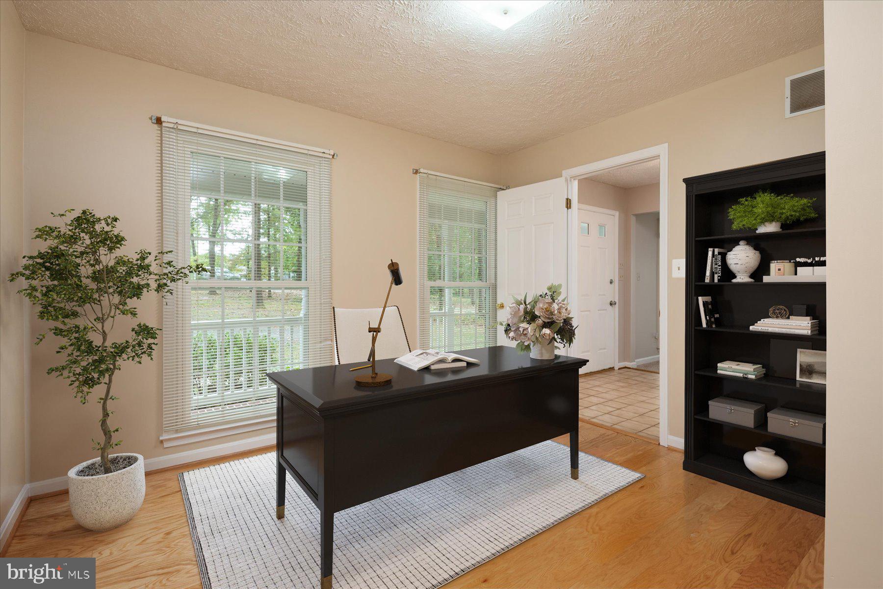 7907 Poplar Grove Road Severn, MD 21144 - Photo 17 of 38 a living room with furniture a window and a potted plant