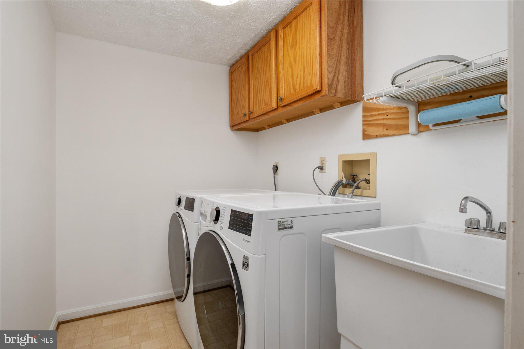 7907 Poplar Grove Road Severn, MD 21144 - Photo 19 of 38 a utility room with dryer and washer