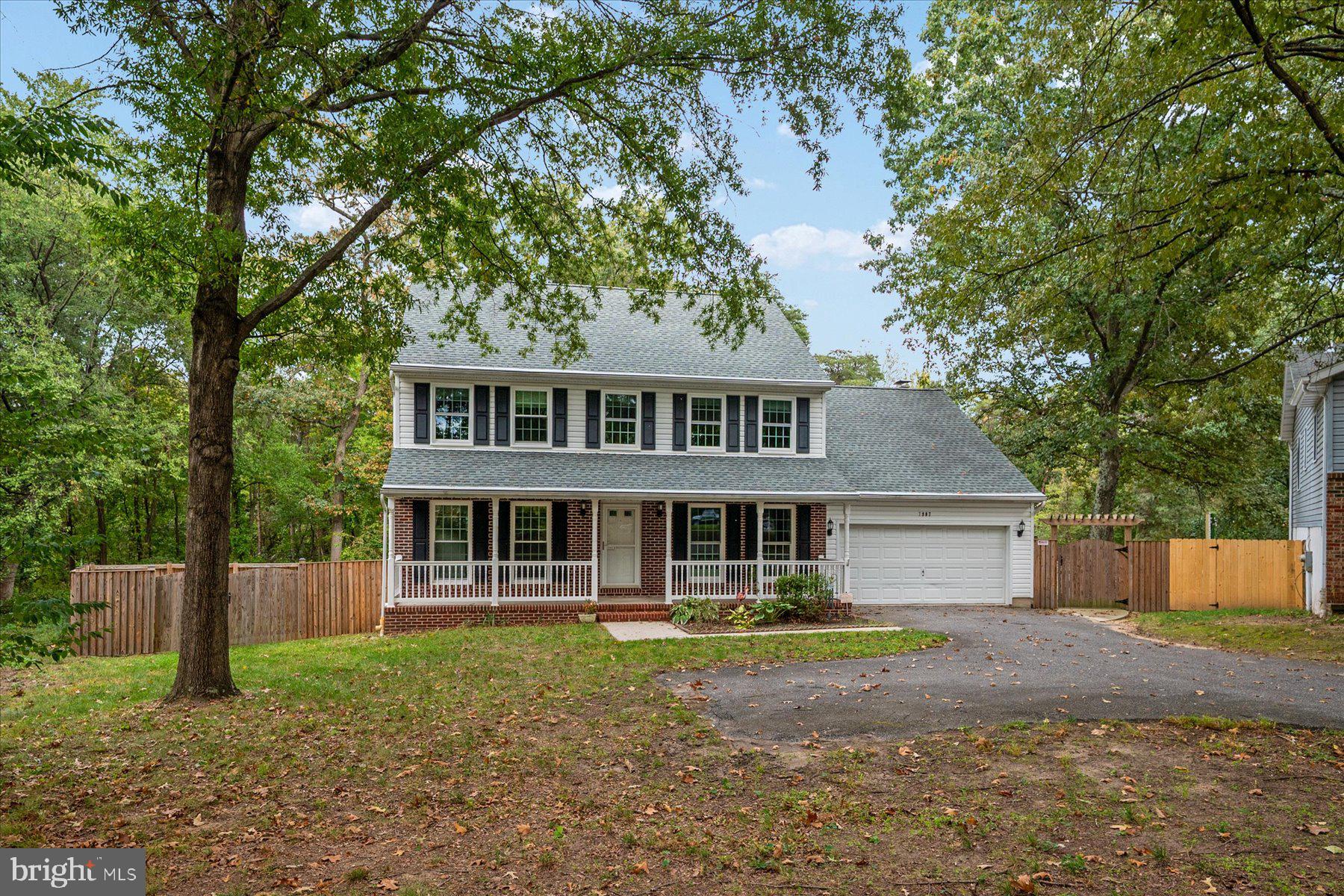 7907 Poplar Grove Road Severn, MD 21144 - Photo 2 of 38 a front view of a house with a yard