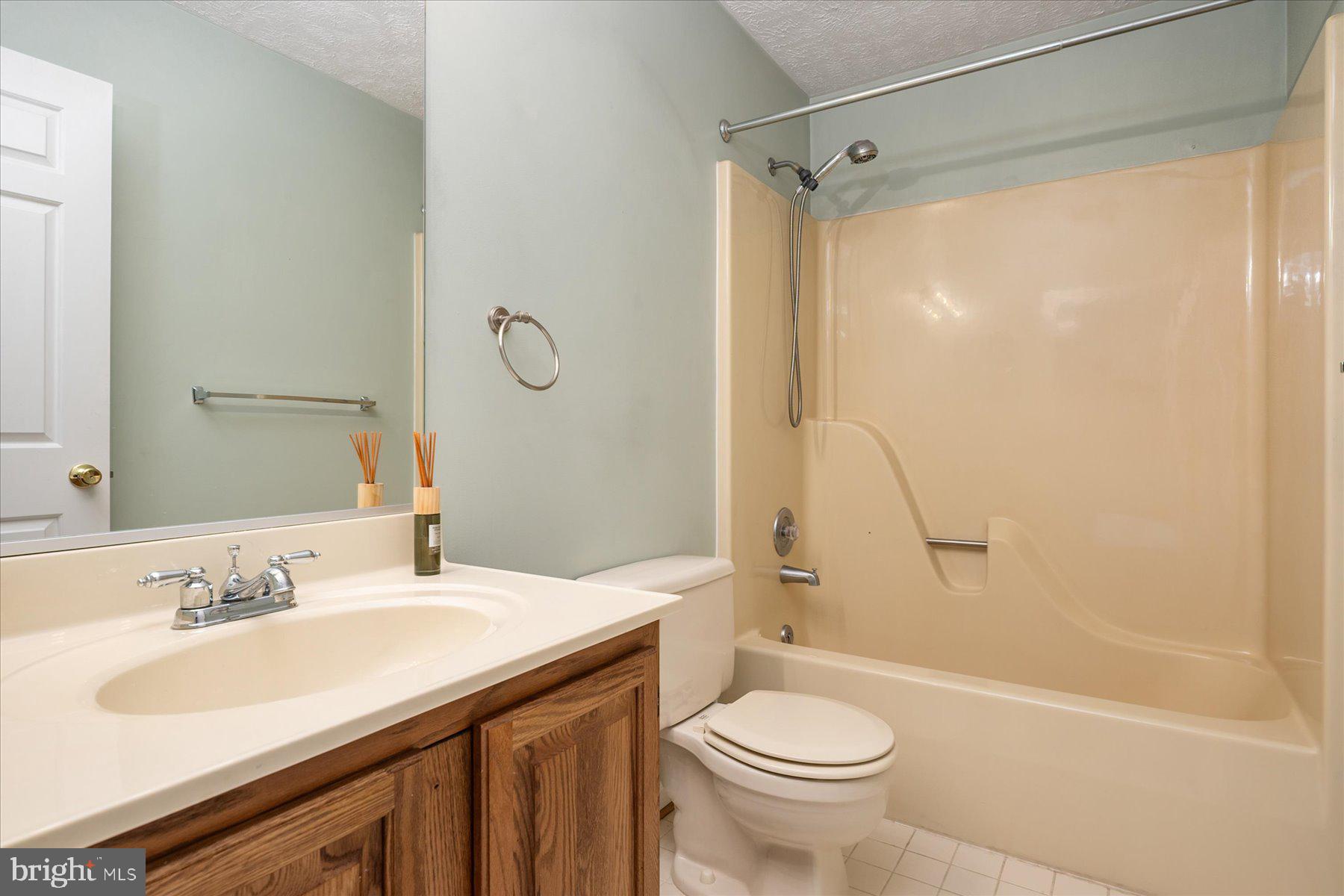 7907 Poplar Grove Road Severn, MD 21144 - Photo 24 of 38 a bathroom with a sink toilet and shower