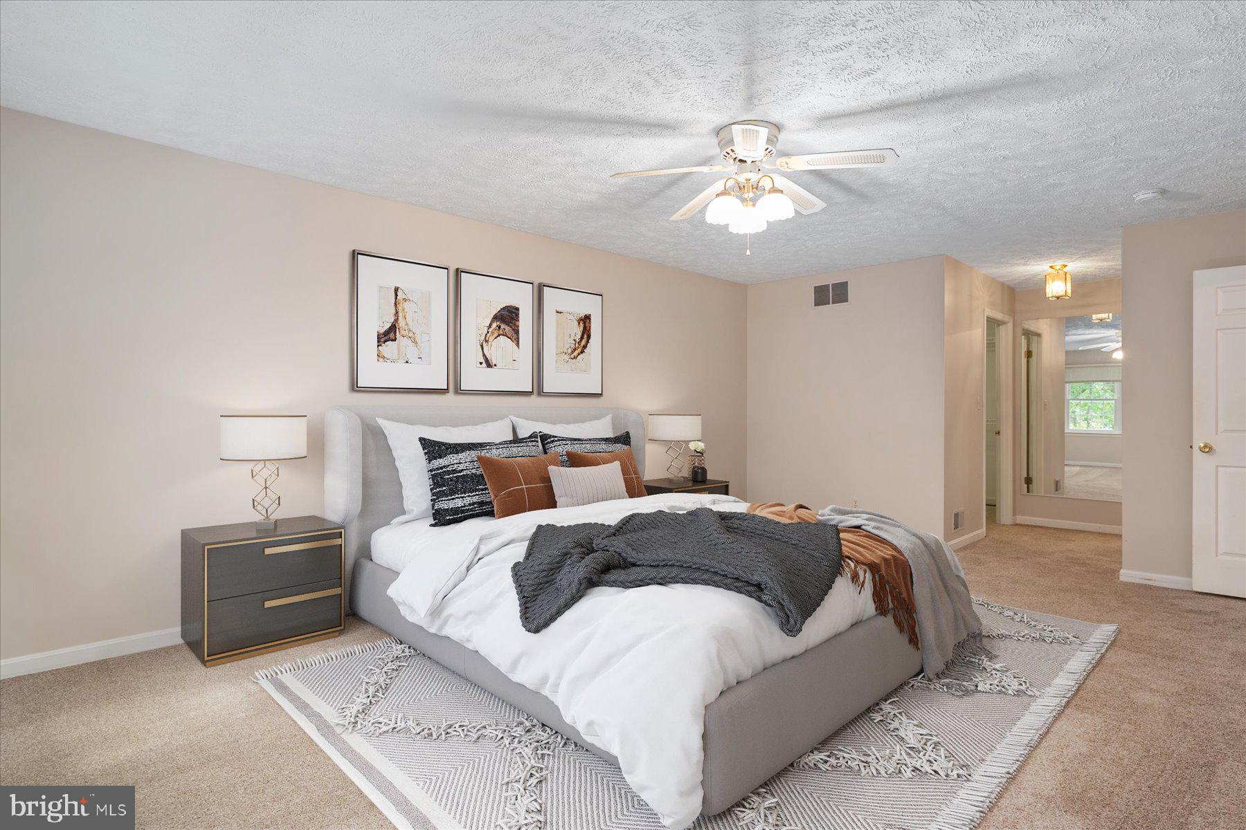 7907 Poplar Grove Road Severn, MD 21144 - Photo 26 of 38 a large bedroom with a bed and a chandelier