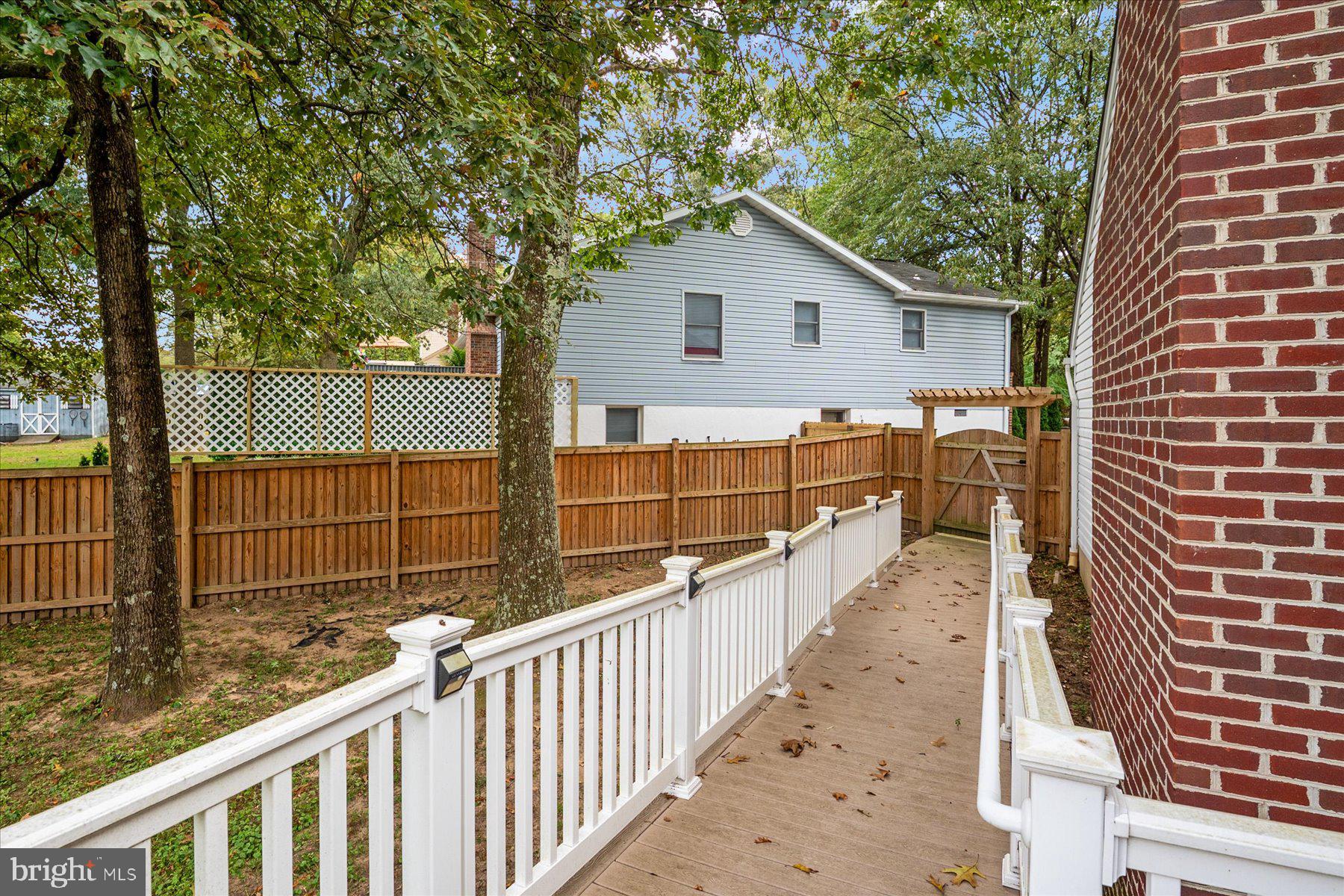 7907 Poplar Grove Road Severn, MD 21144 - Photo 34 of 38 a view of a house with backyard and wooden fence