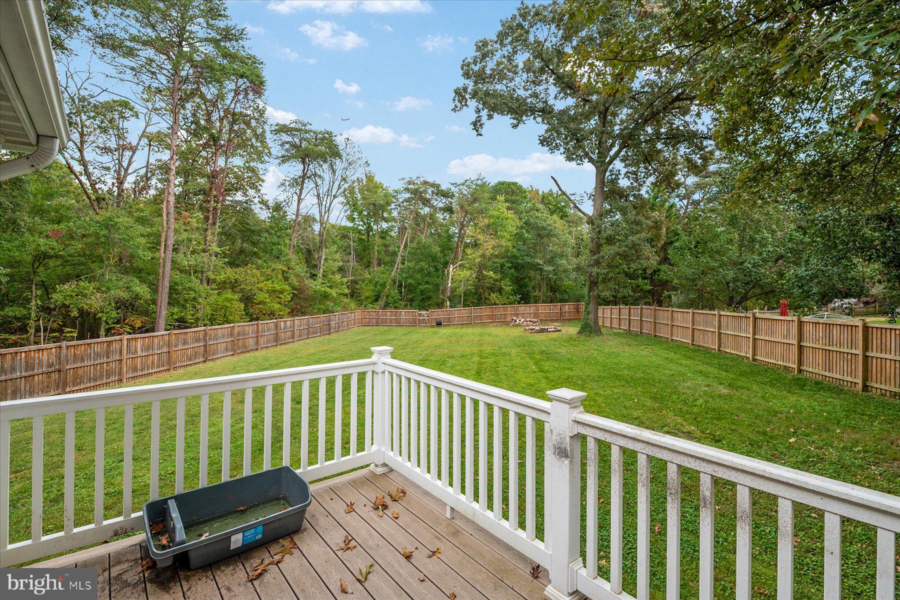 7907 Poplar Grove Road Severn, MD 21144 - Photo 35 of 38 a view of a deck with a yard