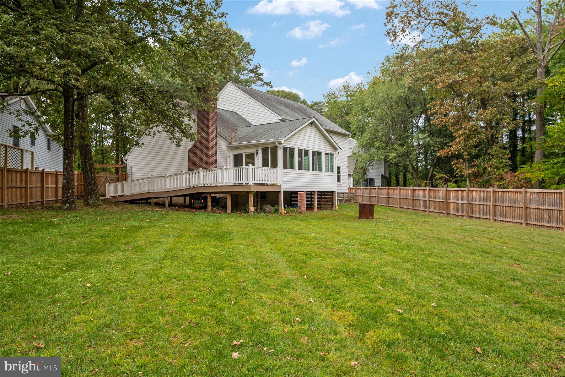 7907 Poplar Grove Road Severn, MD 21144 - Photo 37 of 38 a view of a house with a big yard and large trees