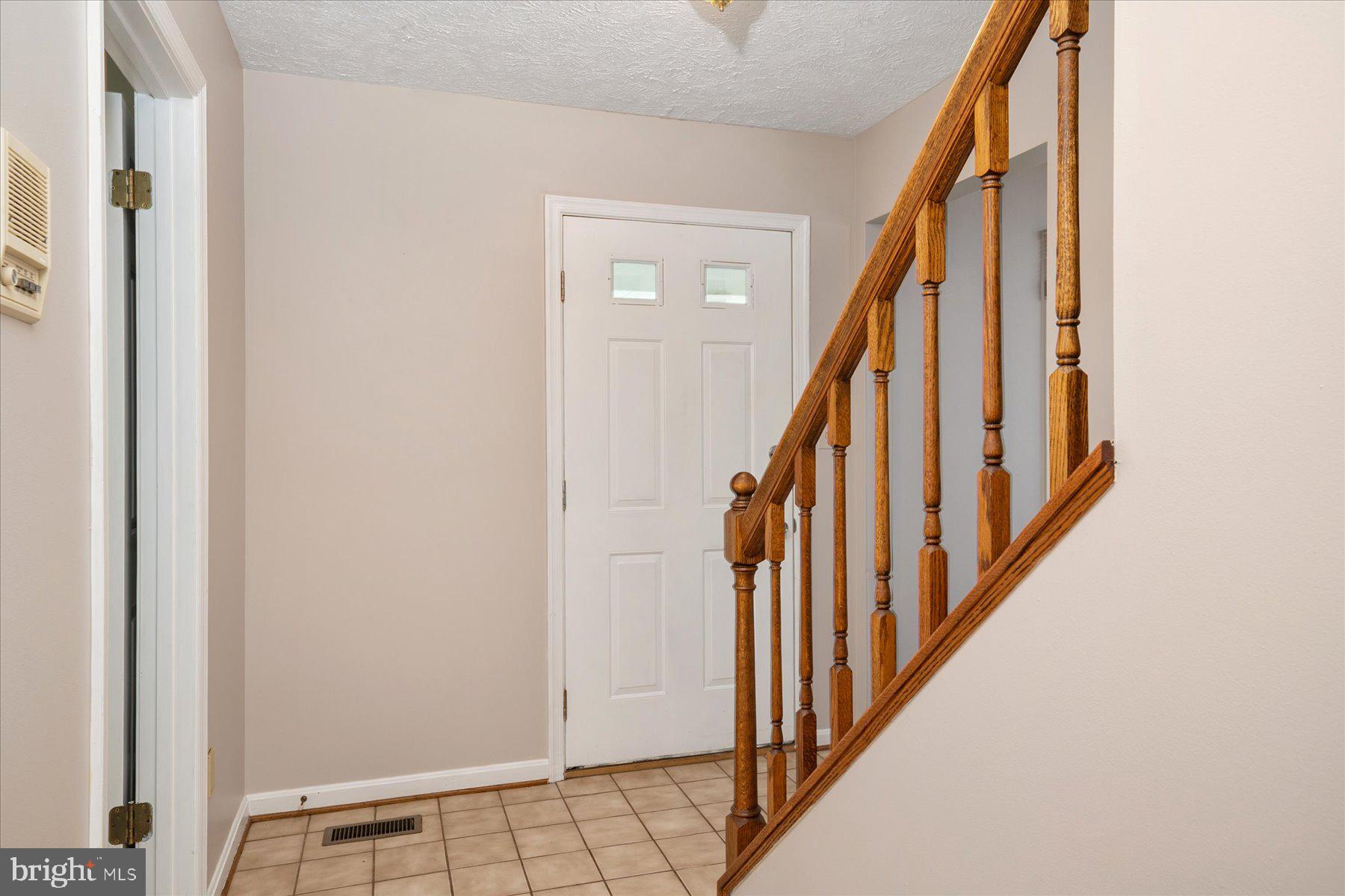 7907 Poplar Grove Road Severn, MD 21144 - Photo 5 of 38 a view of an entryway with staircase