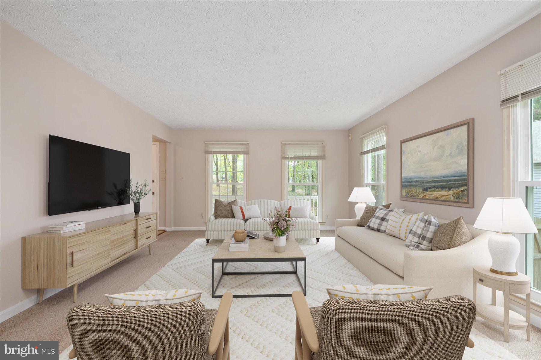 7907 Poplar Grove Road Severn, MD 21144 - Photo 7 of 38 a living room with furniture and a flat screen tv