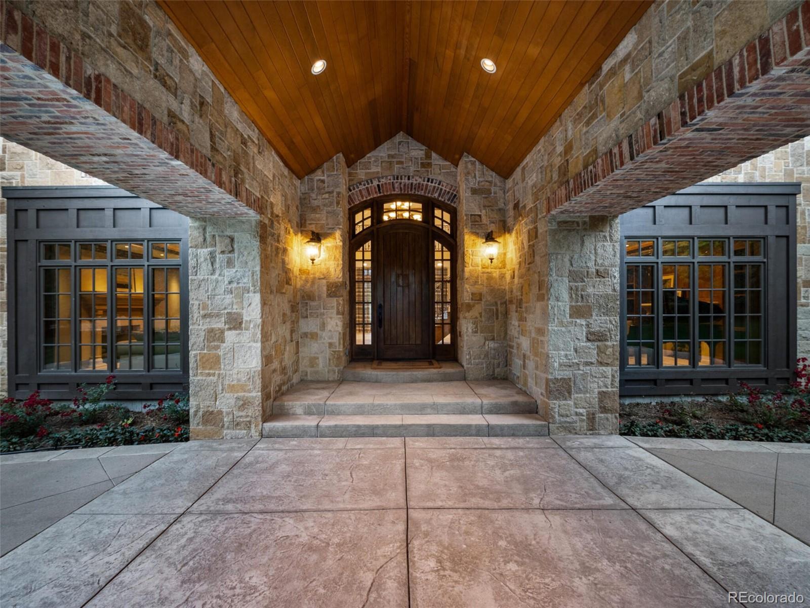 4 Haystack Row Cherry Hills Village, CO 80113 - Photo 11 of 31 a lobby with a door and a glass door
