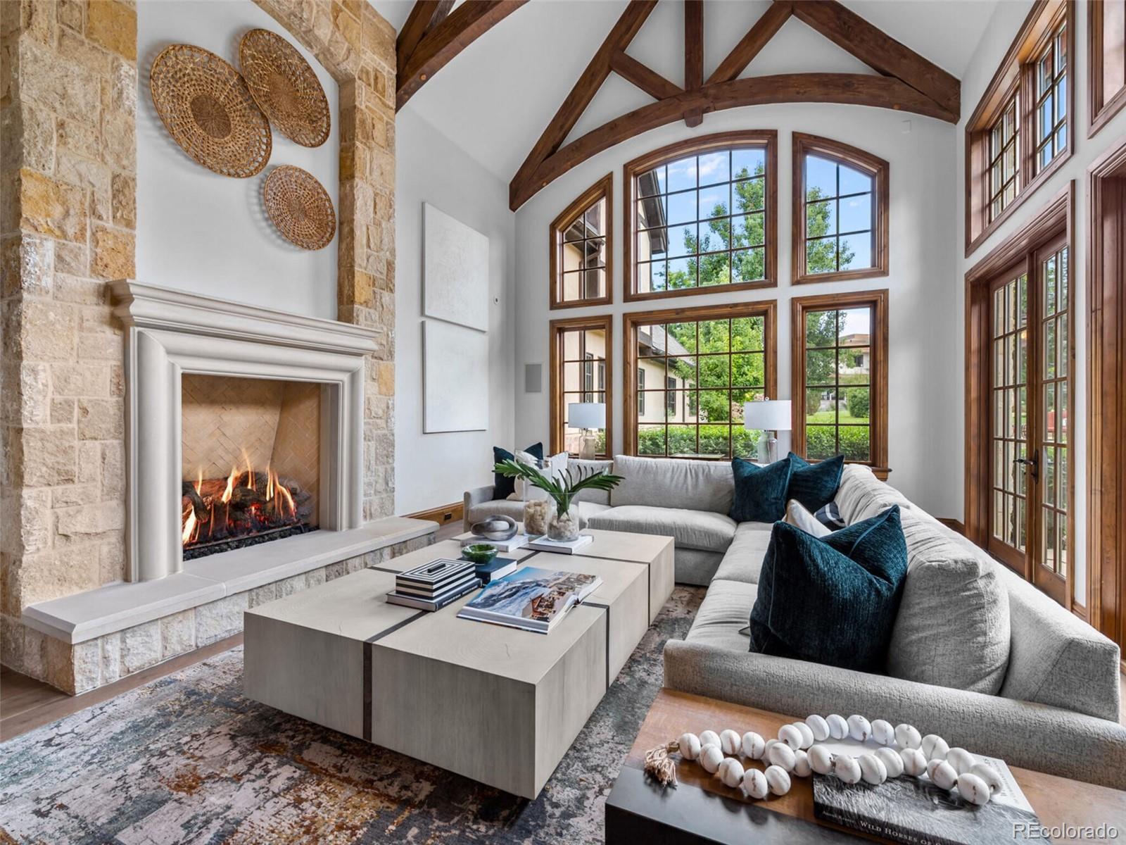 4 Haystack Row Cherry Hills Village, CO 80113 - Photo 17 of 31 a living room with furniture and a fireplace