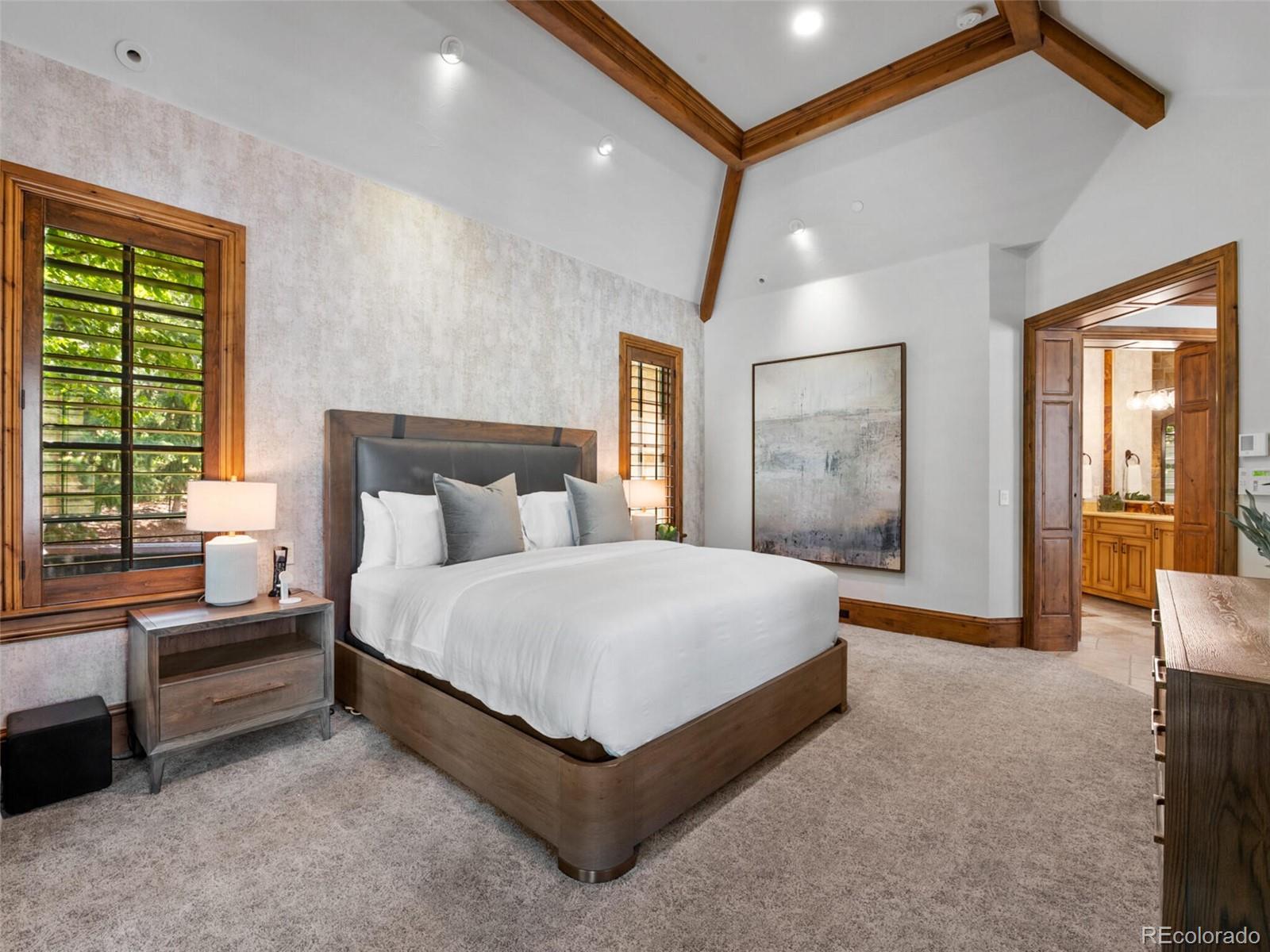 4 Haystack Row Cherry Hills Village, CO 80113 - Photo 19 of 31 a spacious bedroom with a bed and a large window