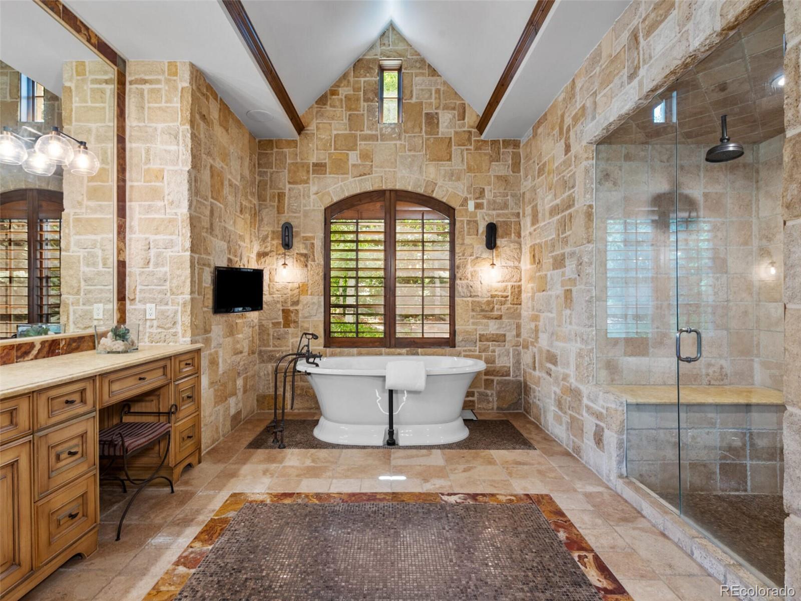 4 Haystack Row Cherry Hills Village, CO 80113 - Photo 21 of 31 a bathroom with a sink and a mirror
