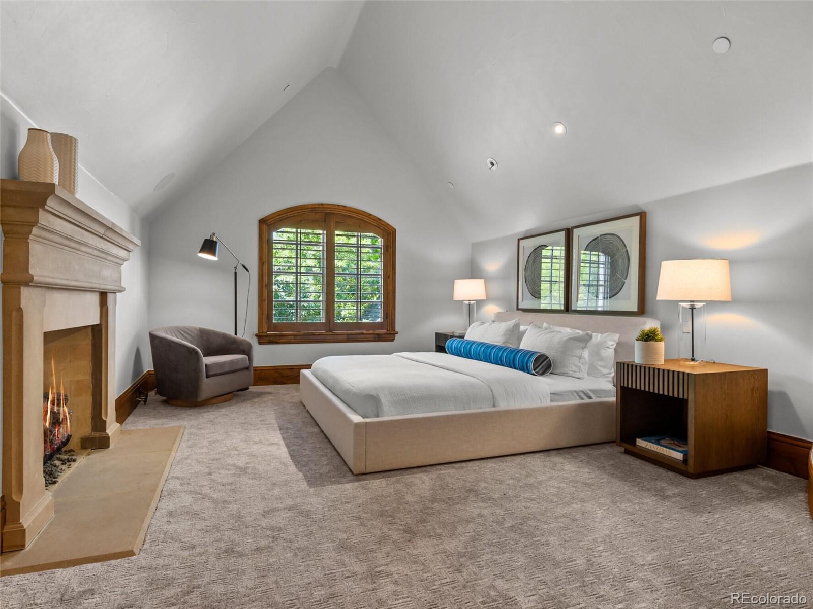 4 Haystack Row Cherry Hills Village, CO 80113 - Photo 22 of 31 a spacious bedroom with a bed and a couch