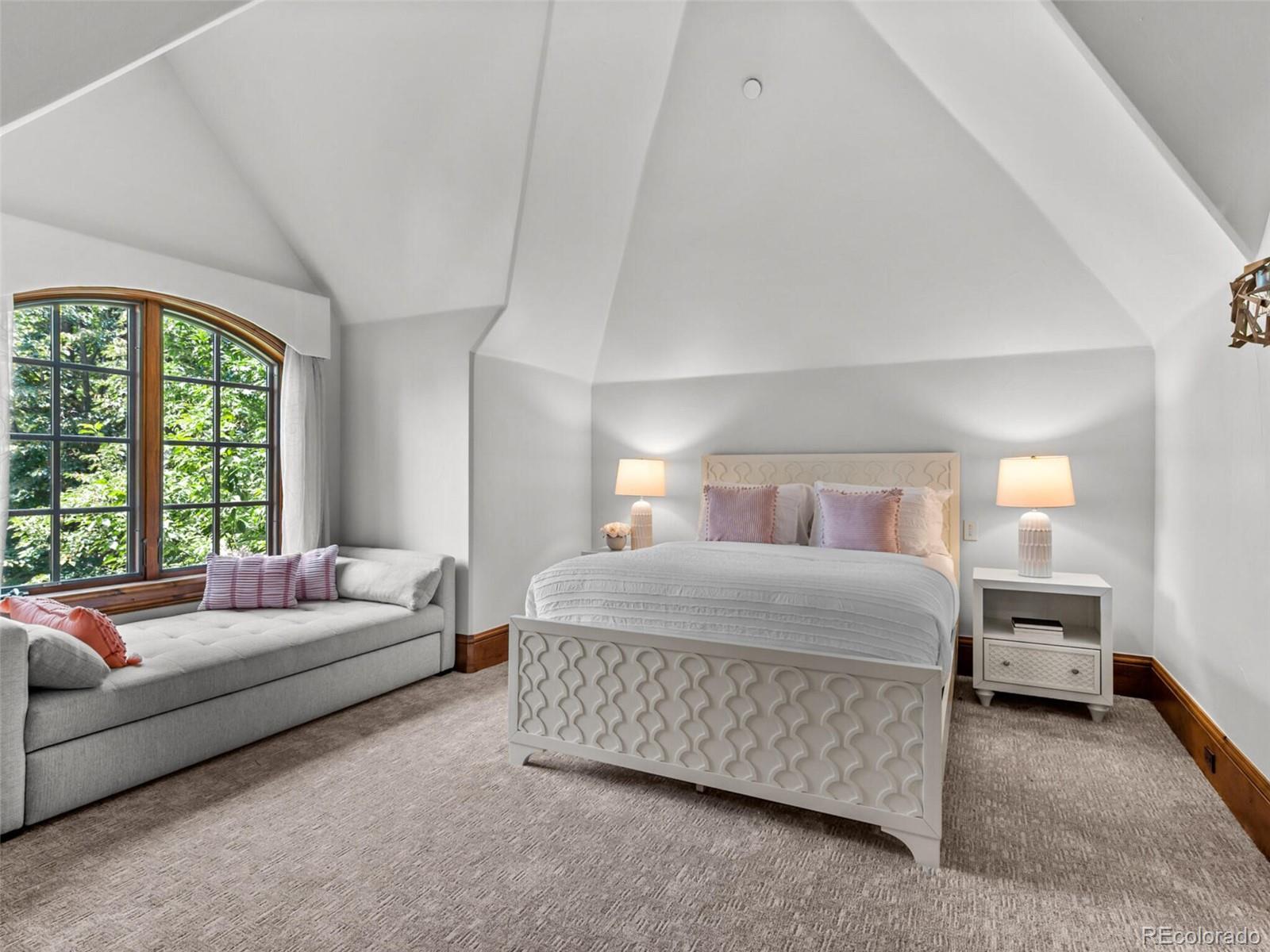 4 Haystack Row Cherry Hills Village, CO 80113 - Photo 24 of 31 a bedroom with a bed and a couch