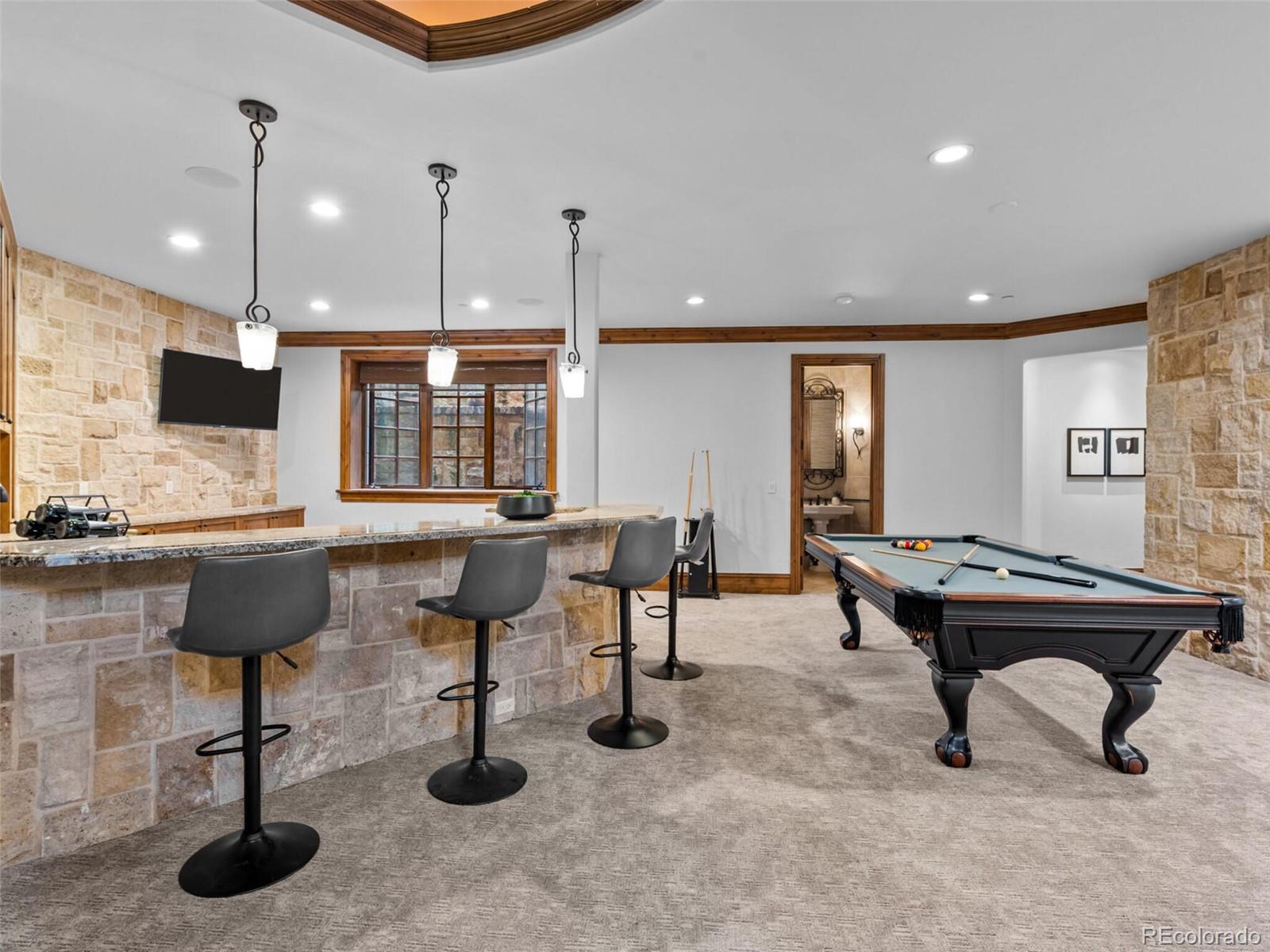 4 Haystack Row Cherry Hills Village, CO 80113 - Photo 27 of 31 a living room with furniture pool and a table