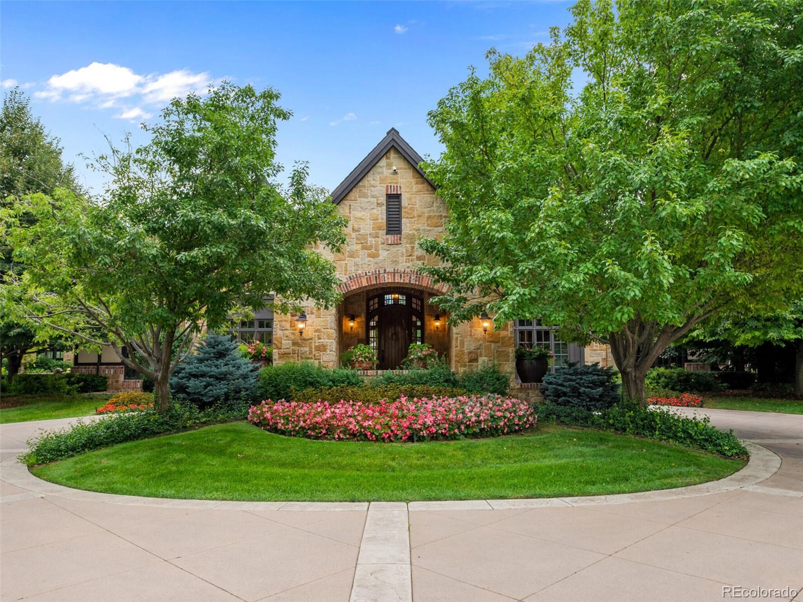 4 Haystack Row Cherry Hills Village, CO 80113 - Photo 3 of 31 a front view of a house with a yard and trees