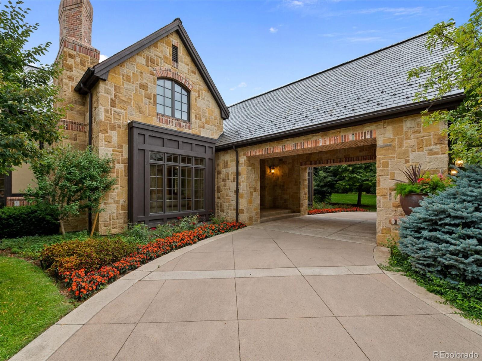 4 Haystack Row Cherry Hills Village, CO 80113 - Photo 4 of 31 a view of backyard with potted plants and a large tree