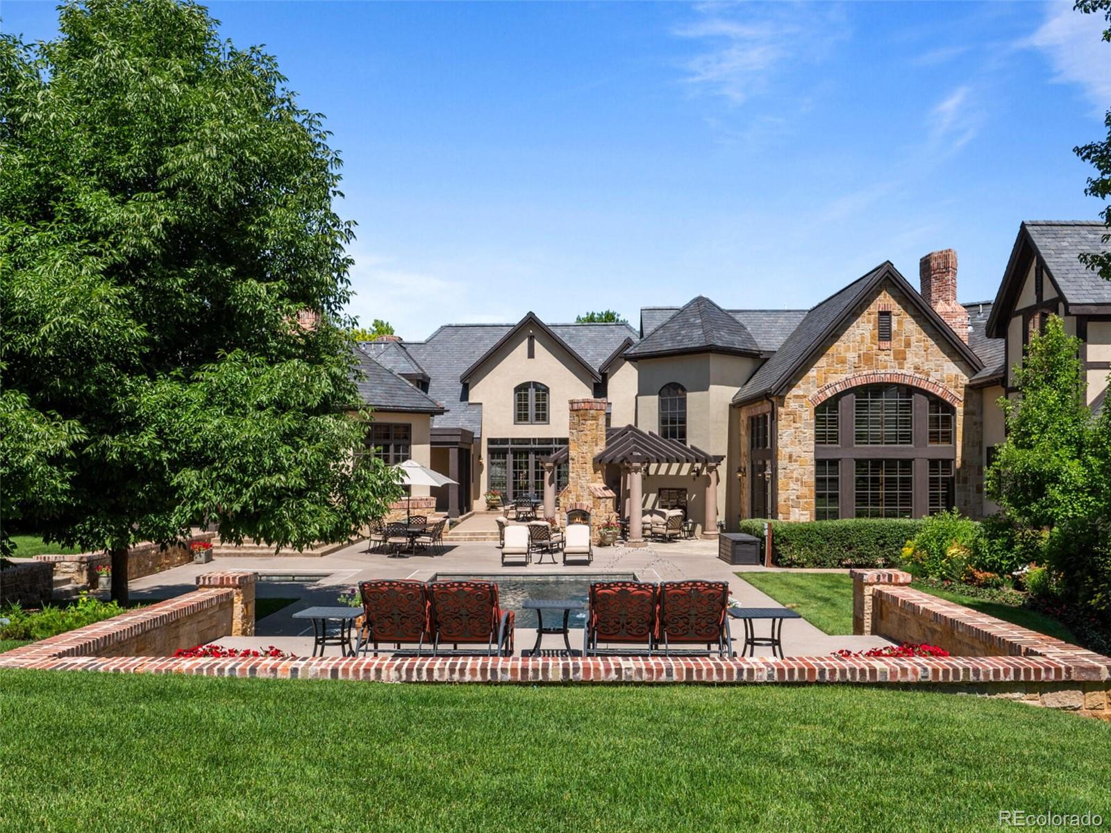4 Haystack Row Cherry Hills Village, CO 80113 - Photo 5 of 31 a front view of a house with a yard and trees