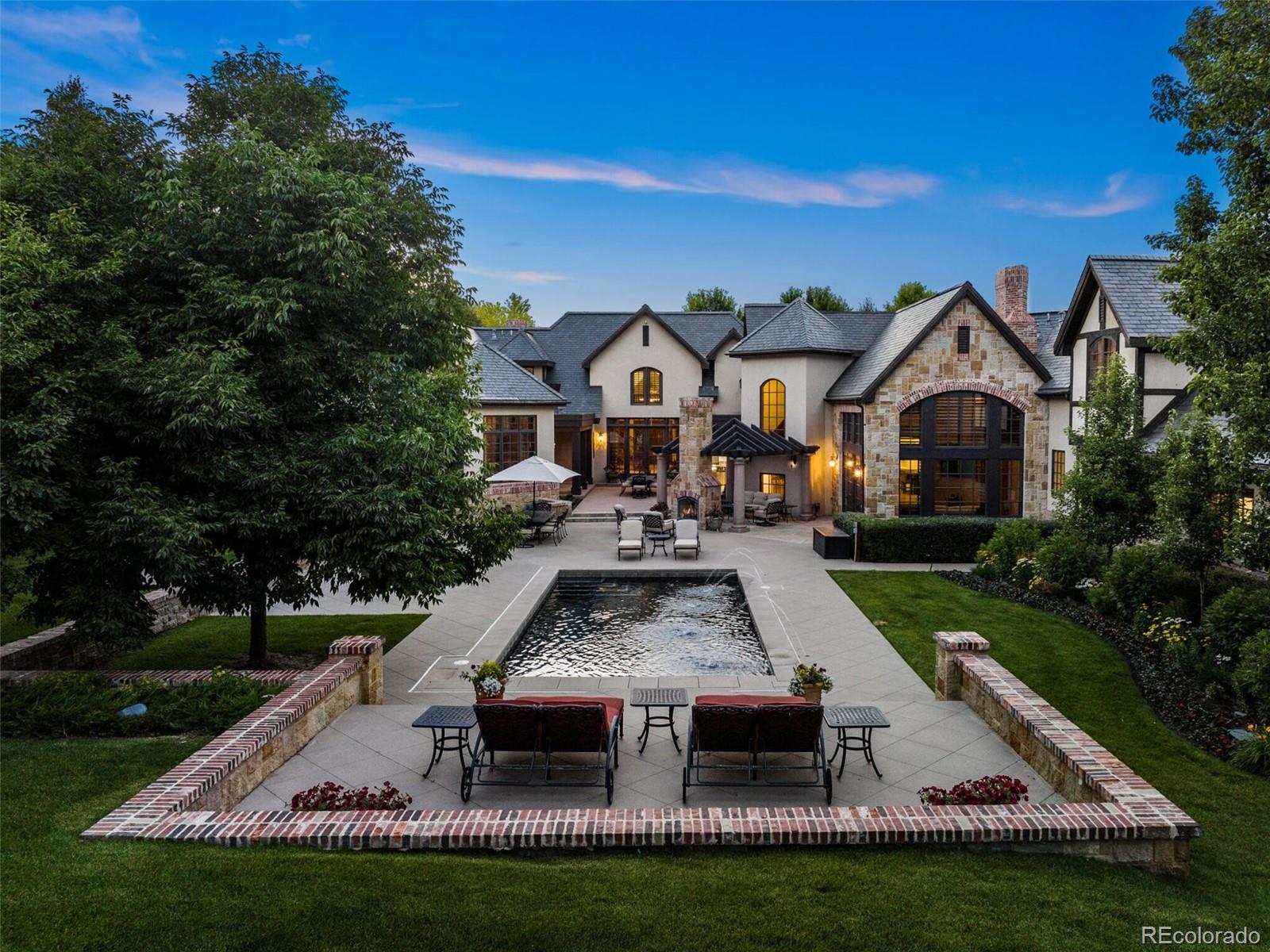 4 Haystack Row Cherry Hills Village, CO 80113 - Photo 9 of 31 a front view of a house with a yard