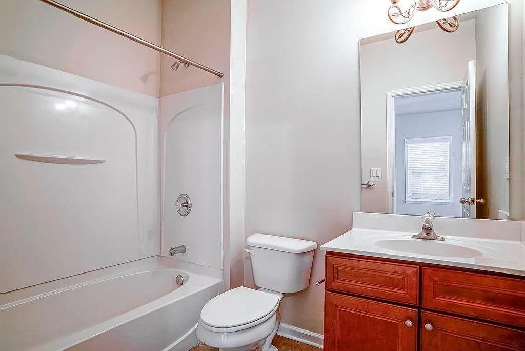 6120 Joybrook Road Duluth, GA 30097 - Photo 26 of 30 a bathroom with a sink mirror toilet and bathtub