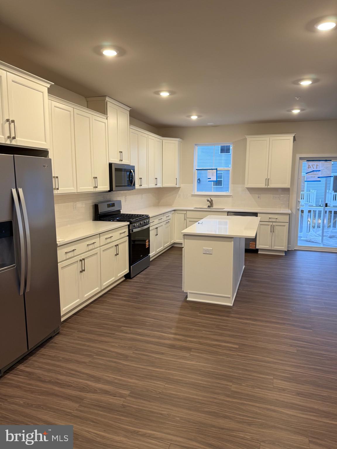 9 Barbine Way Bridgeport, PA 19405 - Photo 4 of 12 a kitchen with stainless steel appliances granite countertop a sink a stove a refrigerator and cabinets