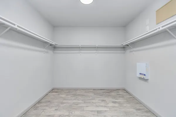 a bathroom with a sink a toilet a mirror and shower